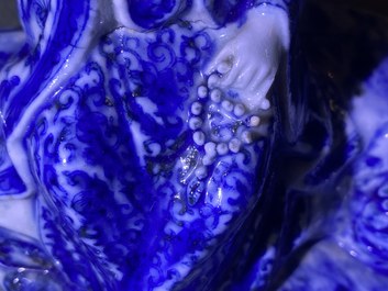 A Chinese blue and white figure of a seated Guanyin, 19th C.